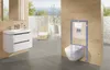 A modern bathroom with a wall-hung toilet and vanity, featuring a view of an outdoor patio. Anteprima dell’immagine prodotto