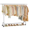 A clothing rack with various garments and shoes displayed against a white background. Náhled obrázku produktu
