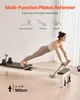 A woman is using a Pilates reformer in a room with a white wall and curtains. Podgląd zdjęcia produktu