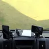 View of a dashboard in a vehicle with accessories placed on it. Produktbild-Vorschau