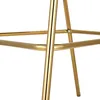 Close-up view of the metallic gold legs and frame of a bar stool. Produktbild-Vorschau