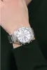 A man's wrist wearing a silver Festina chronograph watch. Produktbild-Vorschau