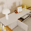 A close-up view of a white shelf with various decorative items and books, part of a larger furniture piece. Anteprima dell’immagine prodotto