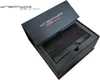 A black Dreambox One Ultra HD device is shown inside its open black packaging. Produktbild-Vorschau