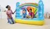 A woman is kneeling next to an inflatable trampoline with two children inside. Voir les images du produit