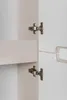 Close-up of cabinet hinges on a beige and white cabinet. Náhľad obrázku produktu