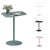 A collection of side tables in different colors, with one table in the foreground featuring a vase of flowers, a magazine, and a cup of coffee. Náhled obrázku produktu