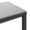 A close-up view of the corner of a table with a marble-like surface and a black frame. Anteprima dell’immagine prodotto