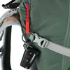 A close-up view of a green backpack with a key fob attached to a strap. Produktbild-Vorschau