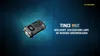 A Nitecore TINI 3 keychain flashlight is displayed against a dark blue, abstract background with light streaks. Podgląd zdjęcia produktu