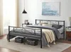 A bedroom scene featuring a metal bed frame with bedding and decorative elements. Produktbild-Vorschau