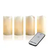 Four LED candles and a remote control are displayed against a white background. Produktbild-Vorschau