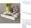 A collage of images showing a white floating shelf with a drawer, decorated with lighthouses and plants. Náhľad obrázku produktu