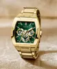 A gold Guess watch with a green face is displayed against a light beige background. Produktbild-Vorschau