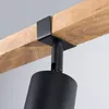 A close-up shot of a black light fixture attached to a wooden beam. Podgląd zdjęcia produktu