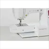 A close-up view of a white sewing machine, focusing on the needle and presser foot area. Produktbild-Vorschau