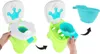 Two images showing a child's potty training seat. The left image shows the potty seat assembled, with a hand lifting the inner seat. The right image shows the potty seat with the inner bucket being removed and a separate inner bucket shown above. Produktbild-Vorschau