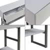 A collage of four close-up images showing details of a light gray console table with dark gray metal legs and shelves. Anteprima dell’immagine prodotto