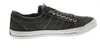 A side view of a green sneaker on a white background. Voir les images du produit