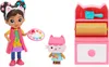 A toy set featuring a doll, a cat figure, and an art studio accessory. Produktbild-Vorschau