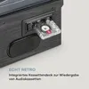 Close-up of a retro-style audio device, showing a cassette tape inserted into a deck. Produktbild-Vorschau
