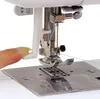 A close-up view of a sewing machine needle and presser foot, with a finger guiding the thread. Produktbild-Vorschau