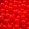 A close-up, overhead view of many small, red, spherical plastic balls. Podgląd zdjęcia produktu