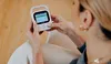 A person is holding and interacting with a baby monitor. Náhled obrázku produktu