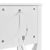 A close-up view of the back of a white cabinet, showing a security cable attached to prevent tipping. Podgląd zdjęcia produktu