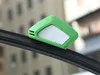 A close-up of a green car windshield wiper repair tool on a black wiper blade. Produktbild-Vorschau