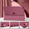 A pink iPad case is shown in a studio setting with draped fabric in the background and three close-up shots of the case's features at the bottom. Produktbild-Vorschau