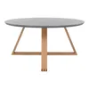 A round coffee table with a gray top and wooden legs, isolated on a white background. Náhled obrázku produktu