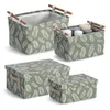 A collection of storage boxes with a leaf pattern. Anteprima dell’immagine prodotto