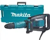 A Makita demolition hammer and its carrying case are displayed against a white background. Anteprima dell’immagine prodotto