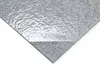 A close-up, angled view of a gray carpet tile with a textured, reflective overlay. Produktbild-Vorschau