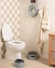 A bathroom scene with a toilet, potty training accessories, and a cabinet. Náhled obrázku produktu