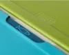 A close-up view of two Joseph Joseph FolioIcon cutting boards, one green and one blue, showing their textured surfaces and embossed logos. Podgląd zdjęcia produktu