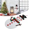 A collage showing a decorated Christmas tree and fireplace scene in the background, and a felt snowman decoration in the foreground. Náhľad obrázku produktu
