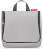 A grey toiletry bag with black zippers and handles, featuring a red Reisenthel logo tag. Produktbild-Vorschau
