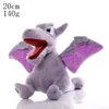 A plush toy of a dragon-like creature with wings, sitting on a white surface. Produktbild-Vorschau