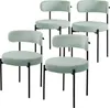 Four green upholstered chairs with black metal legs are arranged in a staggered formation against a white background. Náhled obrázku produktu
