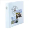 A light blue photo album with a compass design and beach-themed photos. Produktbild-Vorschau