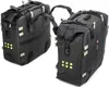 Two black motorcycle saddlebags with yellow reflective dots are shown against a white background. Produktbild-Vorschau
