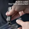 A hand is holding a gray safety hammer and using it to cut a seatbelt. Náhľad obrázku produktu