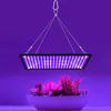 A grow light illuminates a planter with artificial plants. Náhľad obrázku produktu