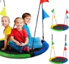 Three children sitting on a colorful nest swing with flags. Náhled obrázku produktu