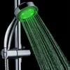 A close-up shot of a shower head with green LED lights illuminating the water spray. Produktbild-Vorschau