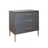 A dark gray dresser with three drawers and wooden handles, shown from a three-quarter angle on a white background. Produktbild-Vorschau