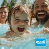 A family laughing and playing in a swimming pool. Produktbild-Vorschau