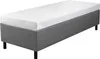 A single bed with a gray upholstered base and a white mattress on top, shown from a slightly elevated side angle against a white background. Produktbild-Vorschau